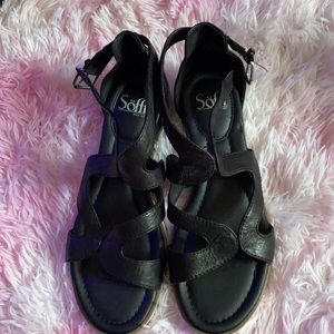 These are a Black pair of sofft sandals.